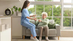 woman-giving-elderly-woman-medication woman-giving-elderly-woman-medication