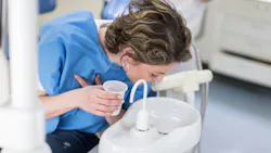 Patient using oral mouth rinse Patient using oral mouth rinse