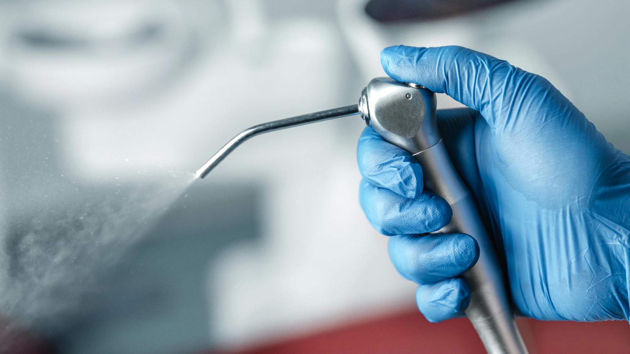 gloved-hand-holding-air-water-syringe