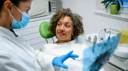 dental hygirnist educating dental patient about best home-care tools dental hygirnist educating dental patient about best home-care tools