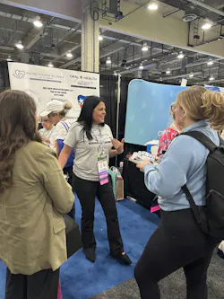 Lisandra Maisonet talks to RDHs interested in the Oral Health Awareness Project at the OHAP booth at RDH Under One Roof. Lisandra Maisonet talks to RDHs interested in the Oral Health Awareness Project at the OHAP booth at RDH Under One Roof.