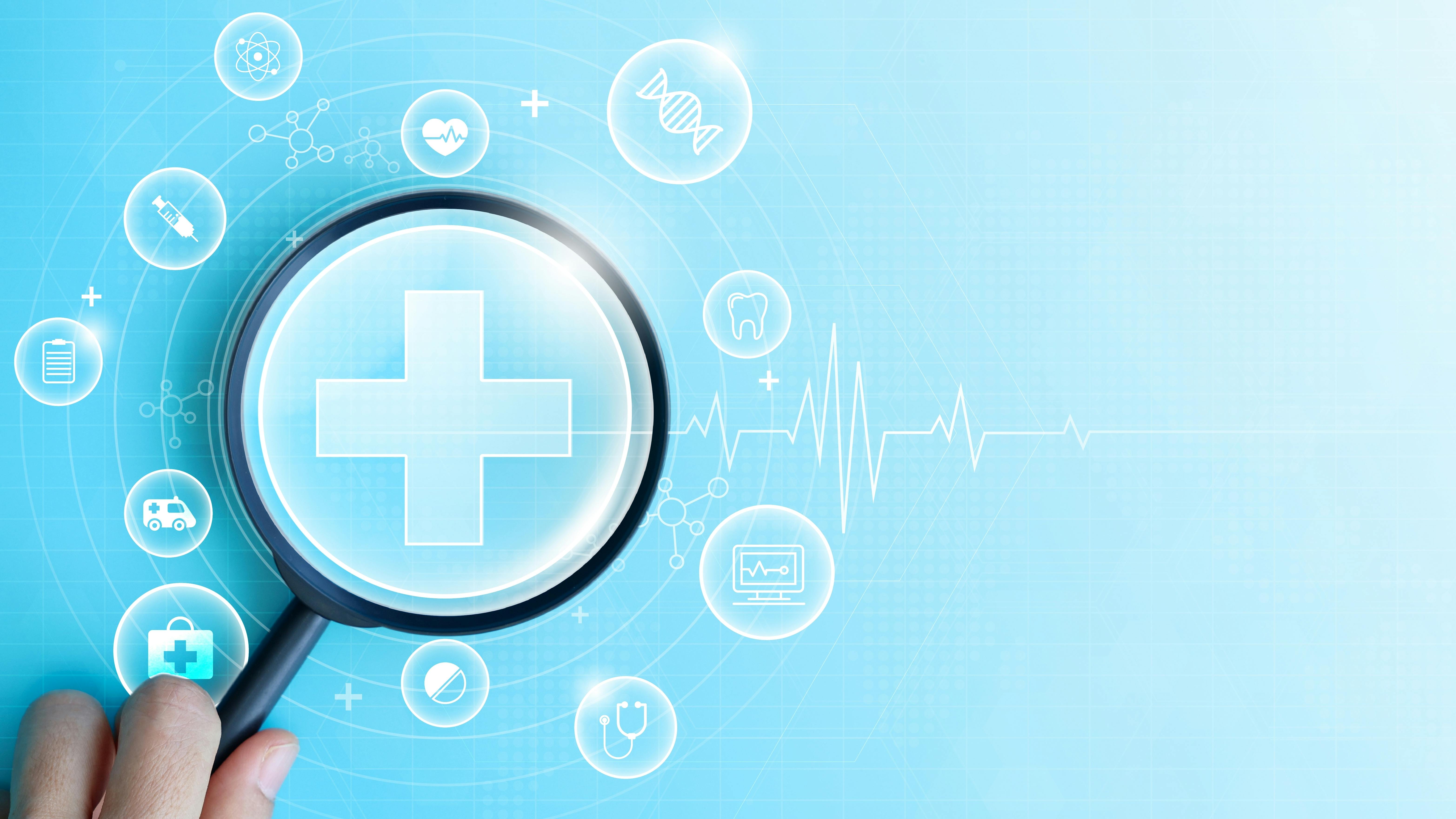 person holding a magnifying glass to focus on health-related graphics