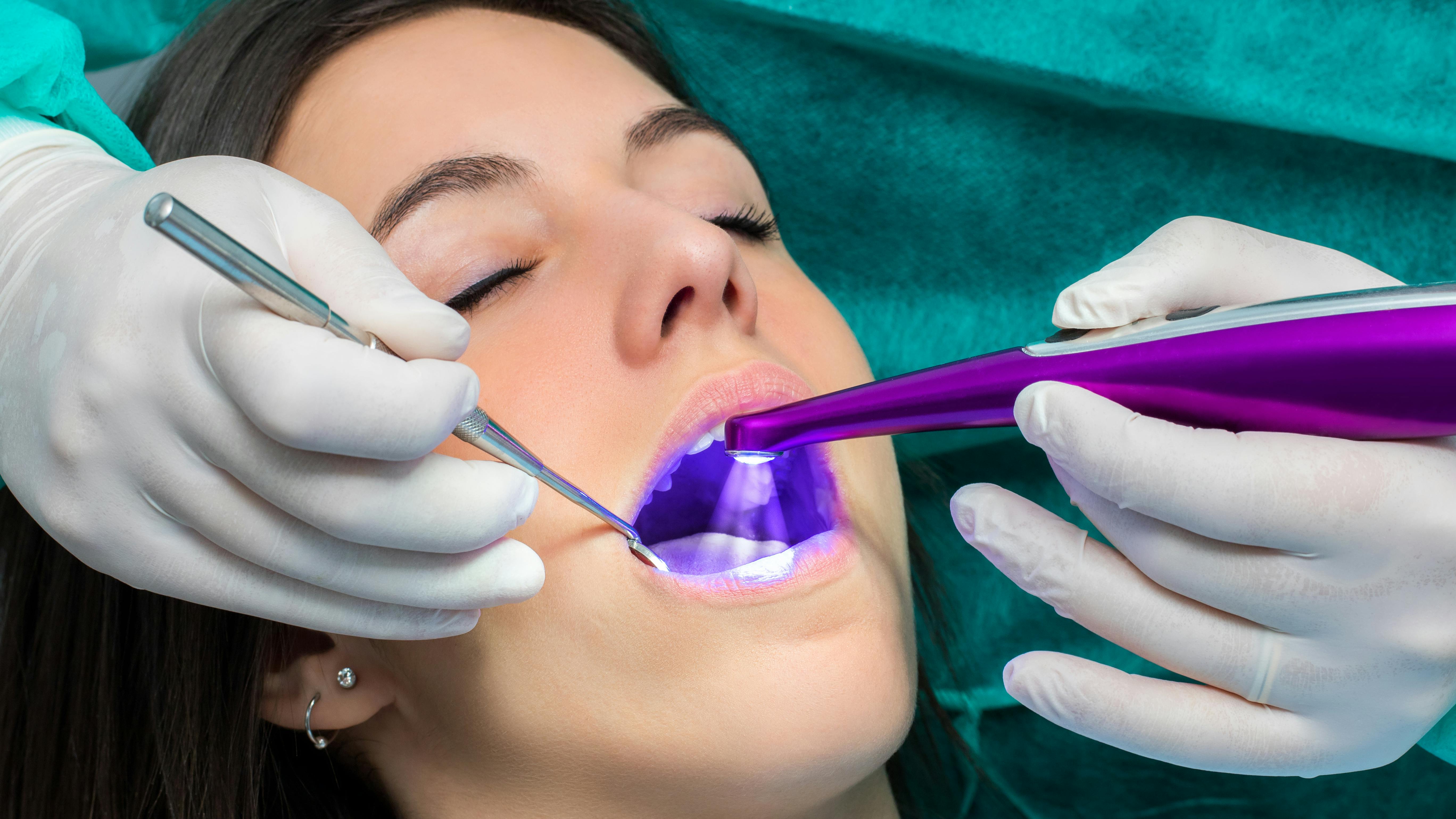 Woman receiving dental sealant