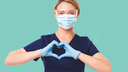 dental hygienist making a heart sign with her gloved hands dental hygienist making a heart sign with her gloved hands