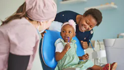 a little girl sitting in a dental chair a little girl sitting in a dental chair