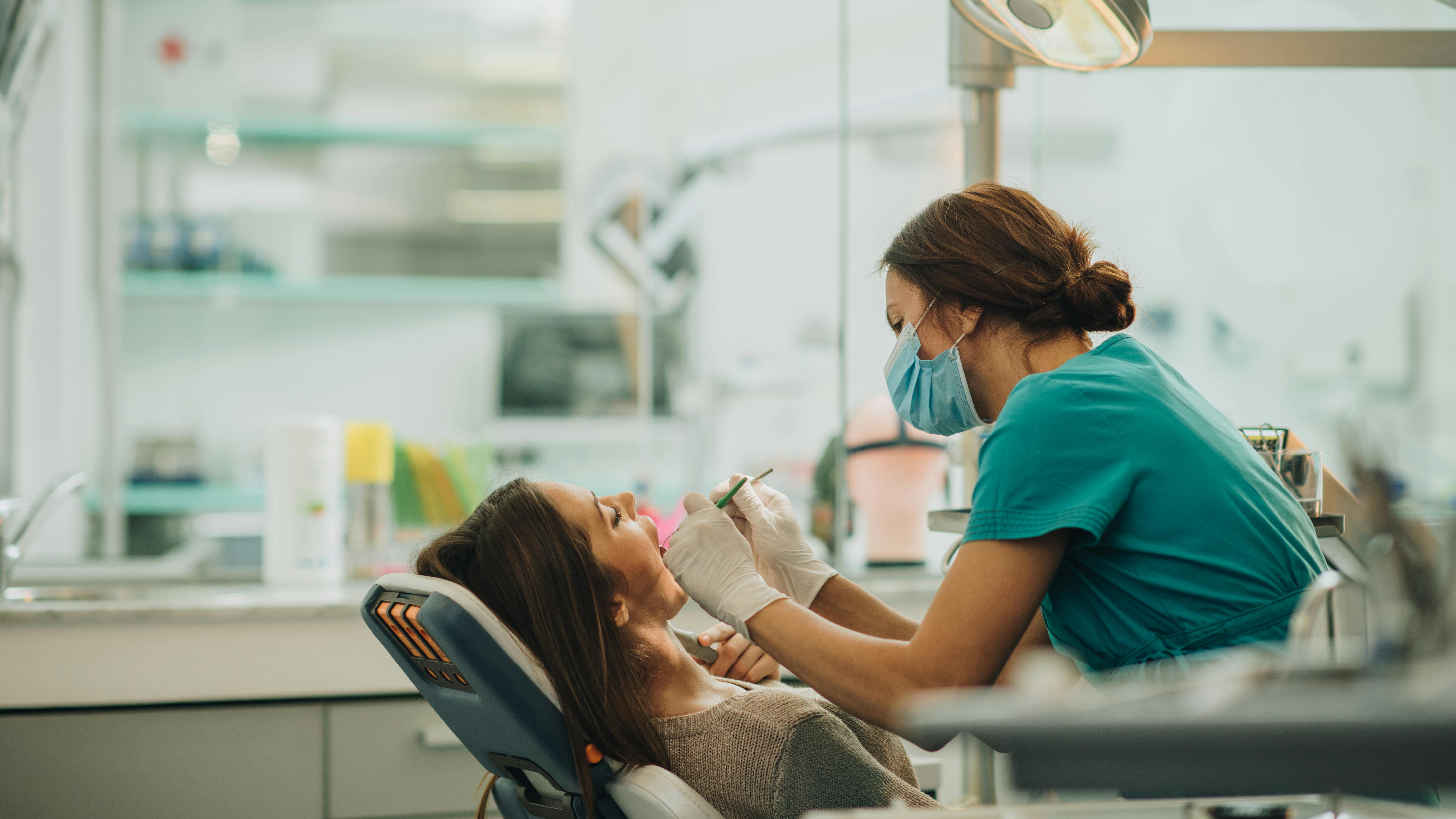 dental hygienist working on a patient