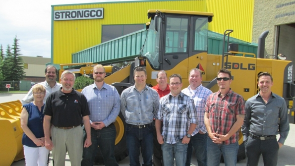Strongco employees in Calgary Alberta celebrate the addition of SDLG wheel loaders to its fleet