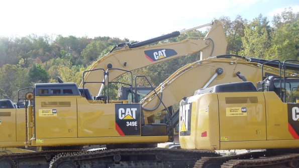 Caterpillar equipment sits at a rental yard Caterpillar is laying off 200 production workers because of soft mining demand