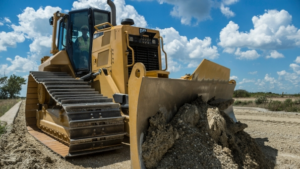 A reduced cost structure helped offset sales softness in the third quarter for Caterpillar