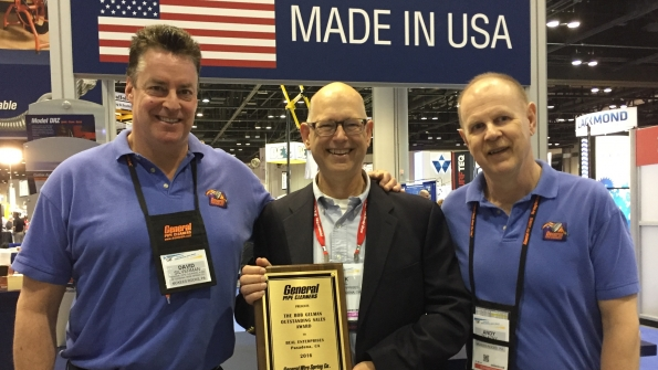 Rick Beal center accepts the Bob Gelman Outstanding Rental Representative Award from David Silverman left global sales manager and Andy Zelazny right national sales manager of General Pipe Cleaners McKees Rocks Pa