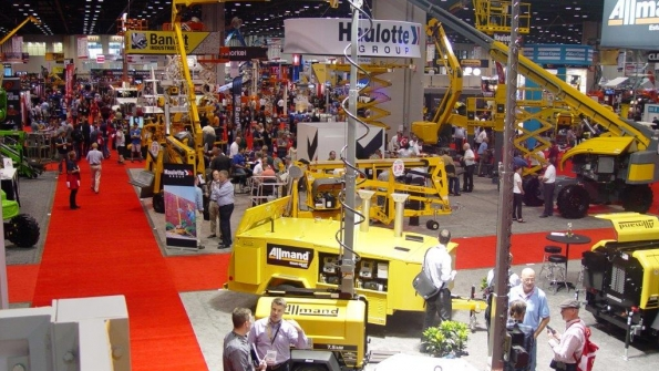 Rental Show attendees visit booths on the first day