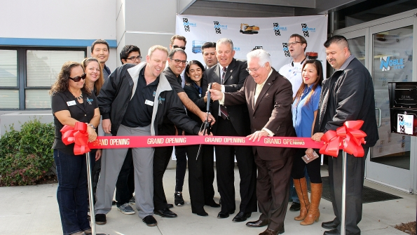 Noble Iron staff cuts ribbon inaugurating its Pico Rivera Calif headquarters