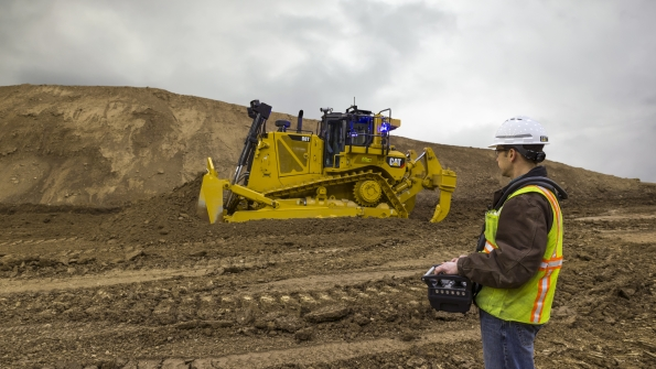 The new Cat Command remote control system for the D8T offers a choice of two operator interfaces a portable operator console designed for lineofsight use and an ergonomically designed operator station that can be located remotely when the dozer is equipped with the Command Vision system