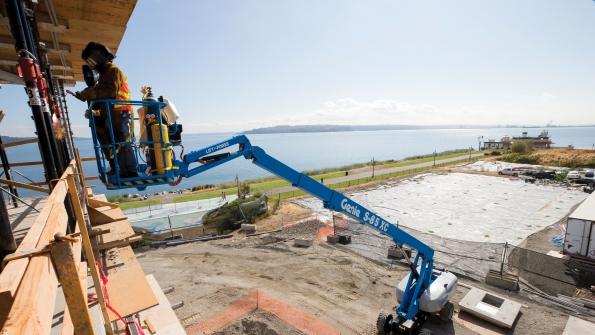 A Genie S85 XC boomlift at work