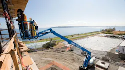 A Genie S85 XC boomlift at work A Genie S85 XC boomlift at work