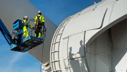 Technicians working on a wind turbine Technicians working on a wind turbine
