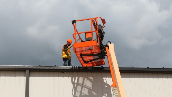 The BoltOn Fall Arrest System consists of two large steel brackets securing a sixfoot cable with a ring that can move from one end of the cable to the other