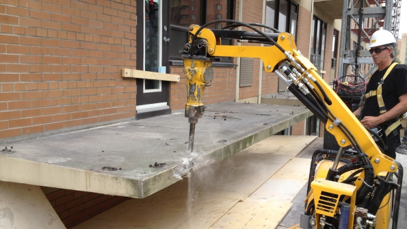 Remotecontrolled demolition machines can be as short as three feet and as narrow as two feet so they can maneuver through doorways into elevators and work in confined spaces