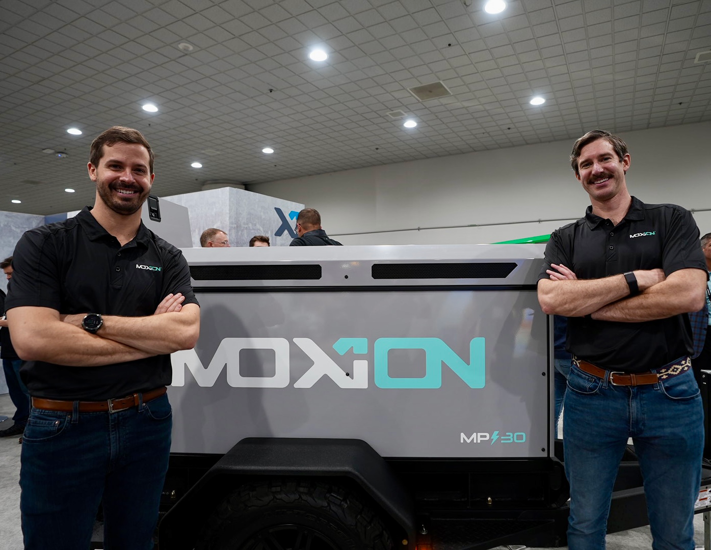 Moxion Paul Huelskamp Ceo And Alexander Meek President In Front Of Mp 30 Unveiled At Con Expo 1 6412a367e87fa
