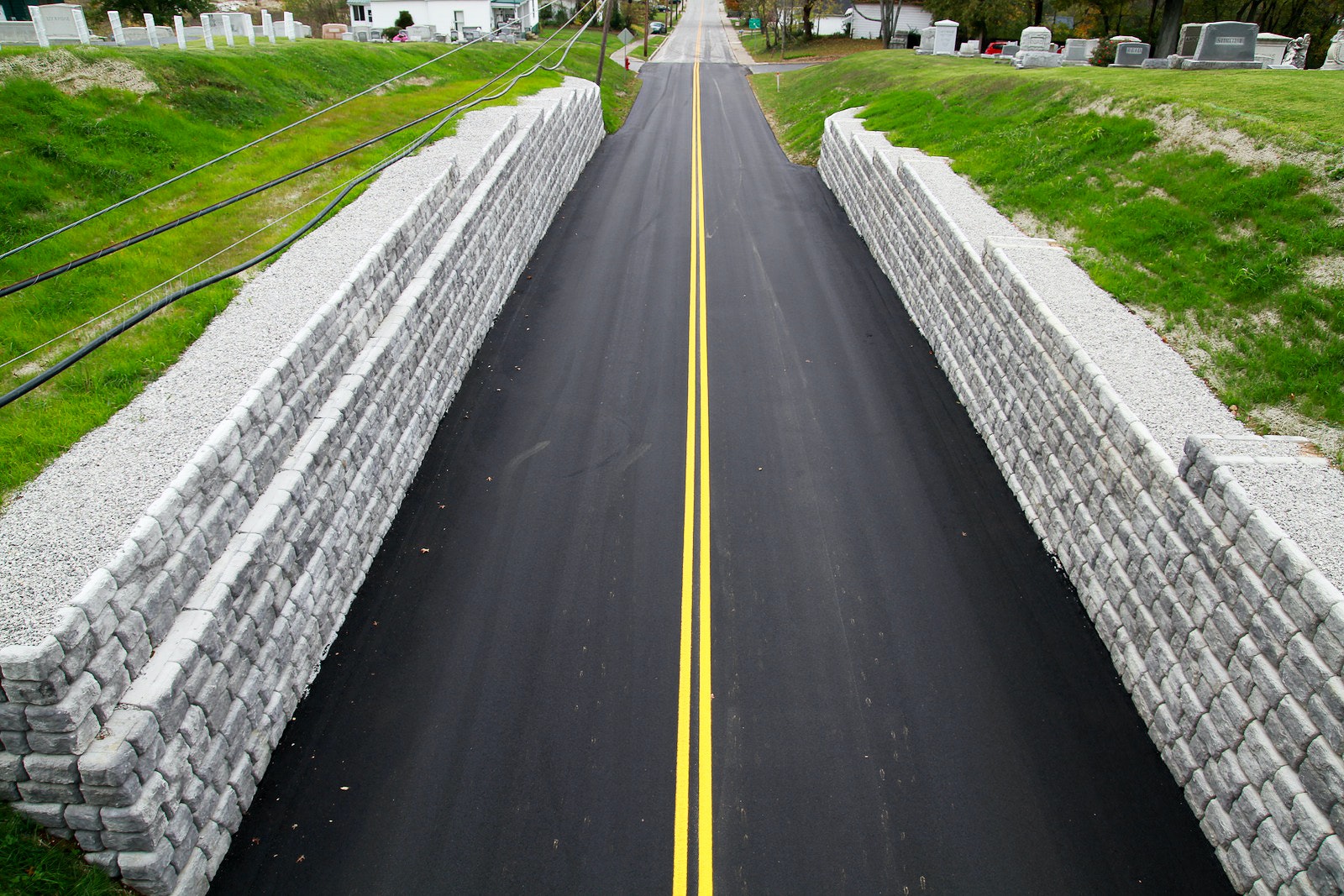 retaining-walls-Redi-Rock-Cobblestone-road-erosion-solution-2