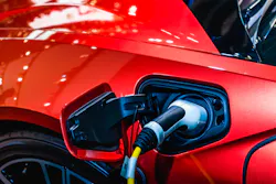 Red Ev Car At Charging Station With The Power Cable Supply Plugged In 62e931dceb369 Red Ev Car At Charging Station With The Power Cable Supply Plugged In 62e931dceb369