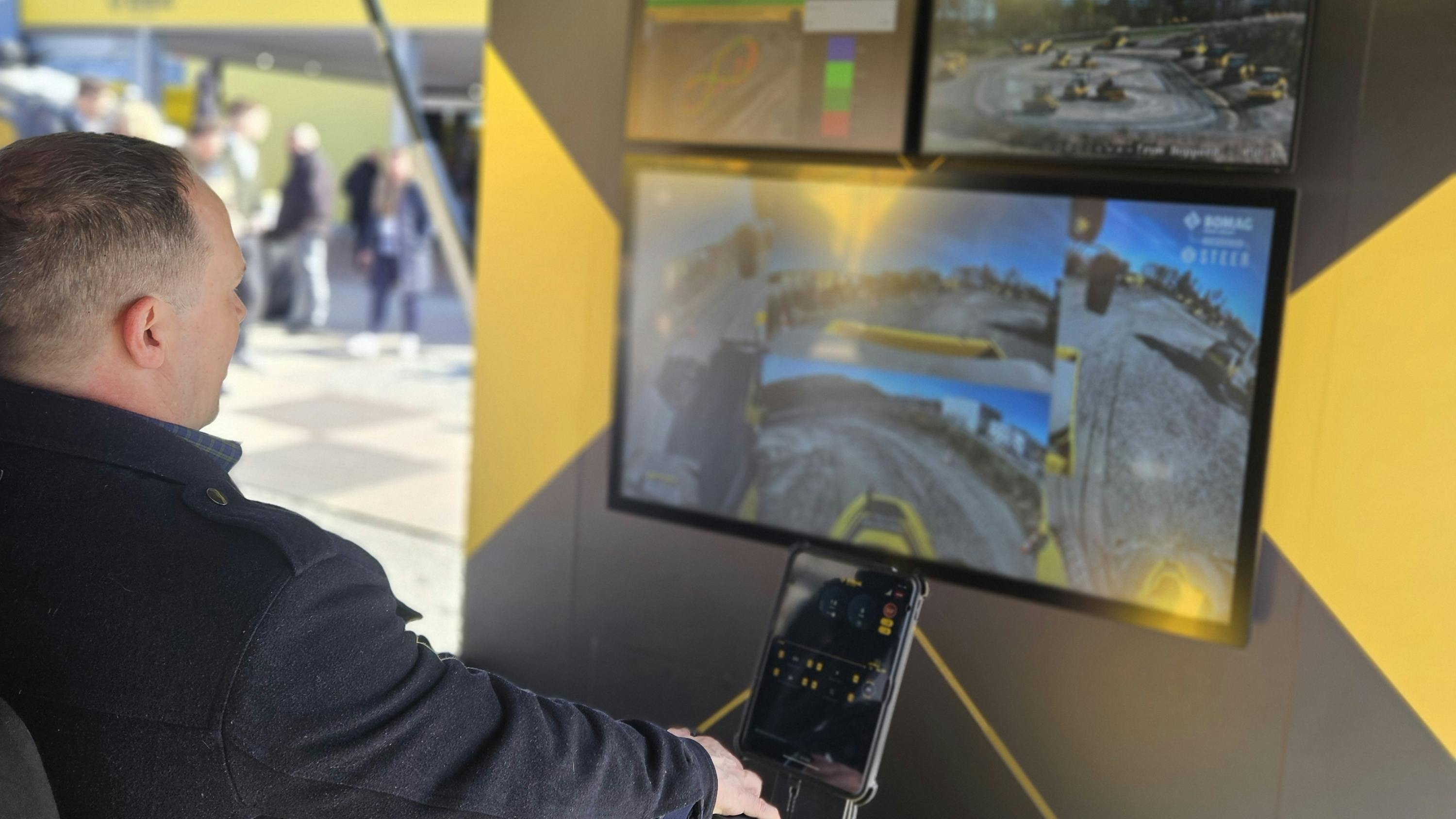Gavin operating the BOMAG single drum roller simulator.