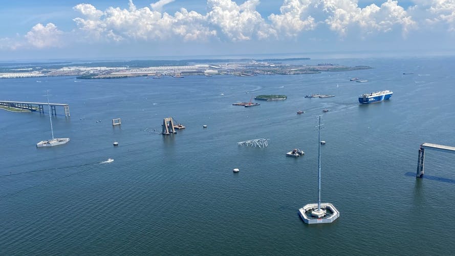Look at the remains of the original Key Bridge structure following the collapse and subsequent cleanup efforts.
