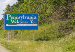 A road sign welcoming drivers to Pennsylvania. A road sign welcoming drivers to Pennsylvania.