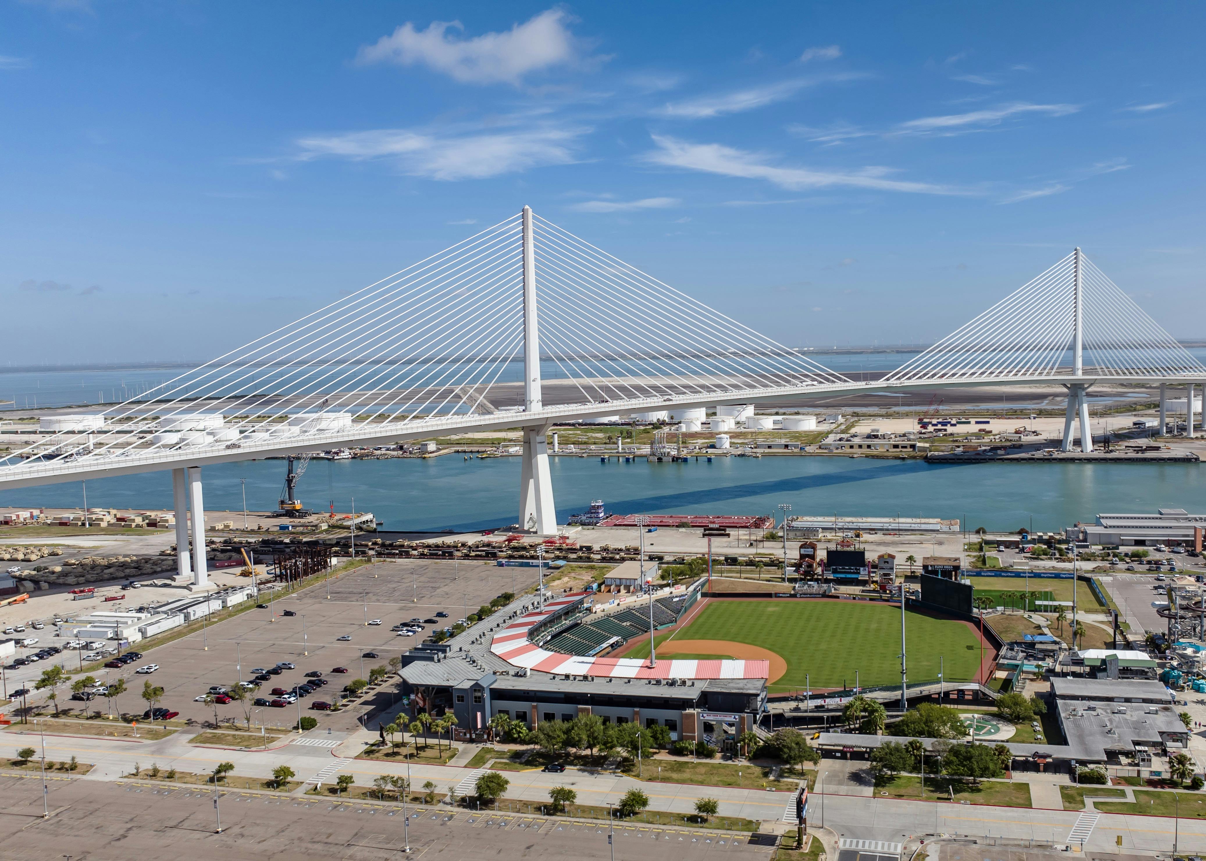 New Harbor Bridge in Corpus Christi, Texas stands tall behind Whataburger Field.