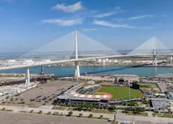 New Harbor Bridge in Corpus Christi, Texas stands tall behind Whataburger Field. New Harbor Bridge in Corpus Christi, Texas stands tall behind Whataburger Field.