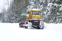 A road grader being used for snow and ice removal A road grader being used for snow and ice removal
