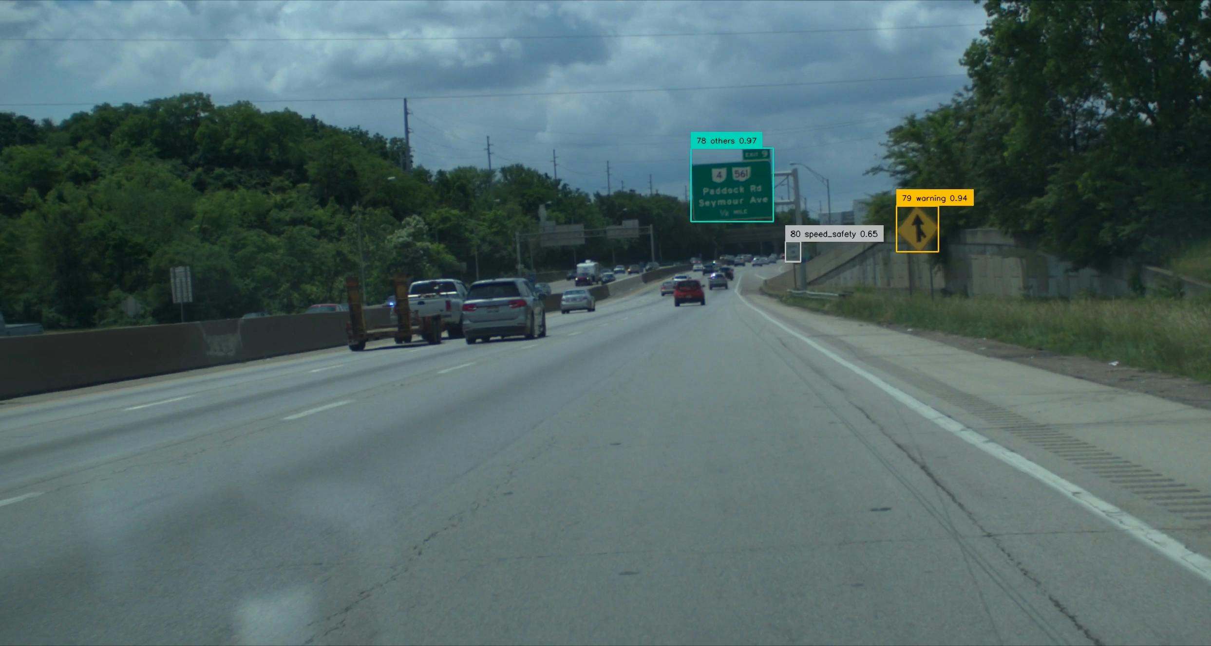 A still image captured by Honda's Proactive Roadway Maintenance System showing deteriorated road signs.
