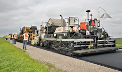 A multi-unit recycling train is working to conduct the Hot Recycling Process on CSAH 9 in Polk County, Minn. A multi-unit recycling train is working to conduct the Hot Recycling Process on CSAH 9 in Polk County, Minn.
