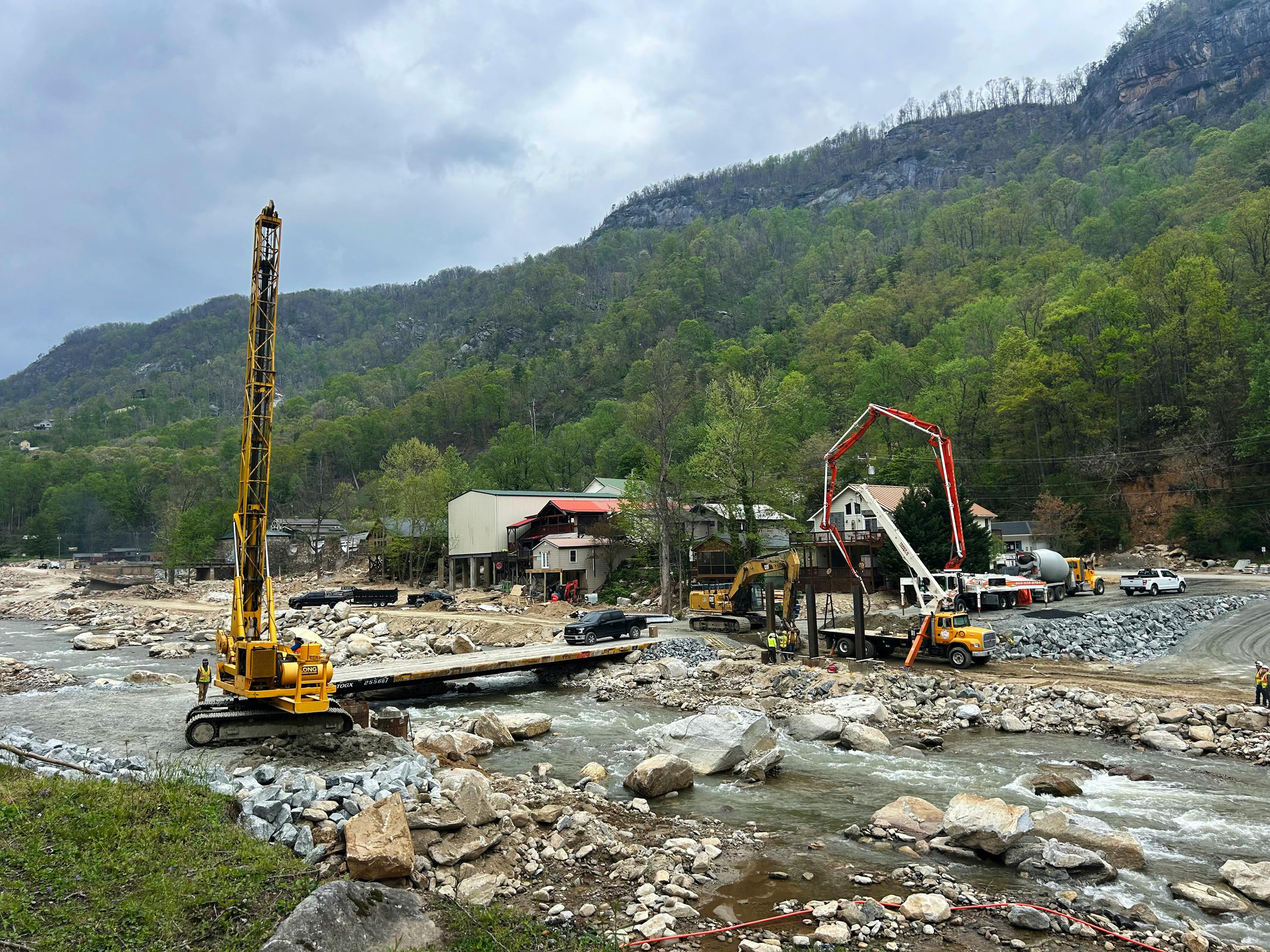 A crane and crews conducting recovery work in the aftermath of Hurriane Helene