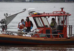 A USGS field team, including Pat Bowen, Kate Bowen, and John Trainor, uses specialized equipment to measure spring floodwaters at Chesapeake Bay's largest tributary, the Susquehanna River in Maryland. The team has an interesting strategy to deal with conflicts between sample-collection protocols and Covid-19 safe-distancing recommendations. Pat and Kate are married, so they can safely work together, while John maintains a safe distance at the helm. A USGS field team, including Pat Bowen, Kate Bowen, and John Trainor, uses specialized equipment to measure spring floodwaters at Chesapeake Bay's largest tributary, the Susquehanna River in Maryland. The team has an interesting strategy to deal with conflicts between sample-collection protocols and Covid-19 safe-distancing recommendations. Pat and Kate are married, so they can safely work together, while John maintains a safe distance at the helm.