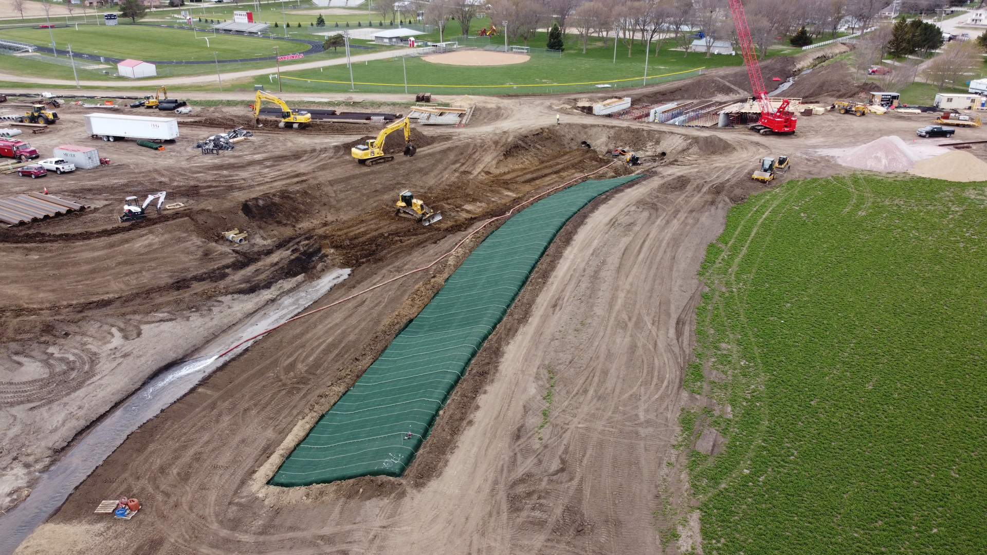 To remove most of the town from the floodplain, the USACE Omaha District widened a 1.5 mile segment of Middle Logan Creek.