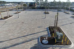 Rock storage beneath the pavers created an underground reservoir for rainwater. Rock storage beneath the pavers created an underground reservoir for rainwater.