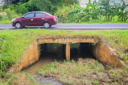 A reinforced concrete box culvert running under an embankment. A reinforced concrete box culvert running under an embankment.