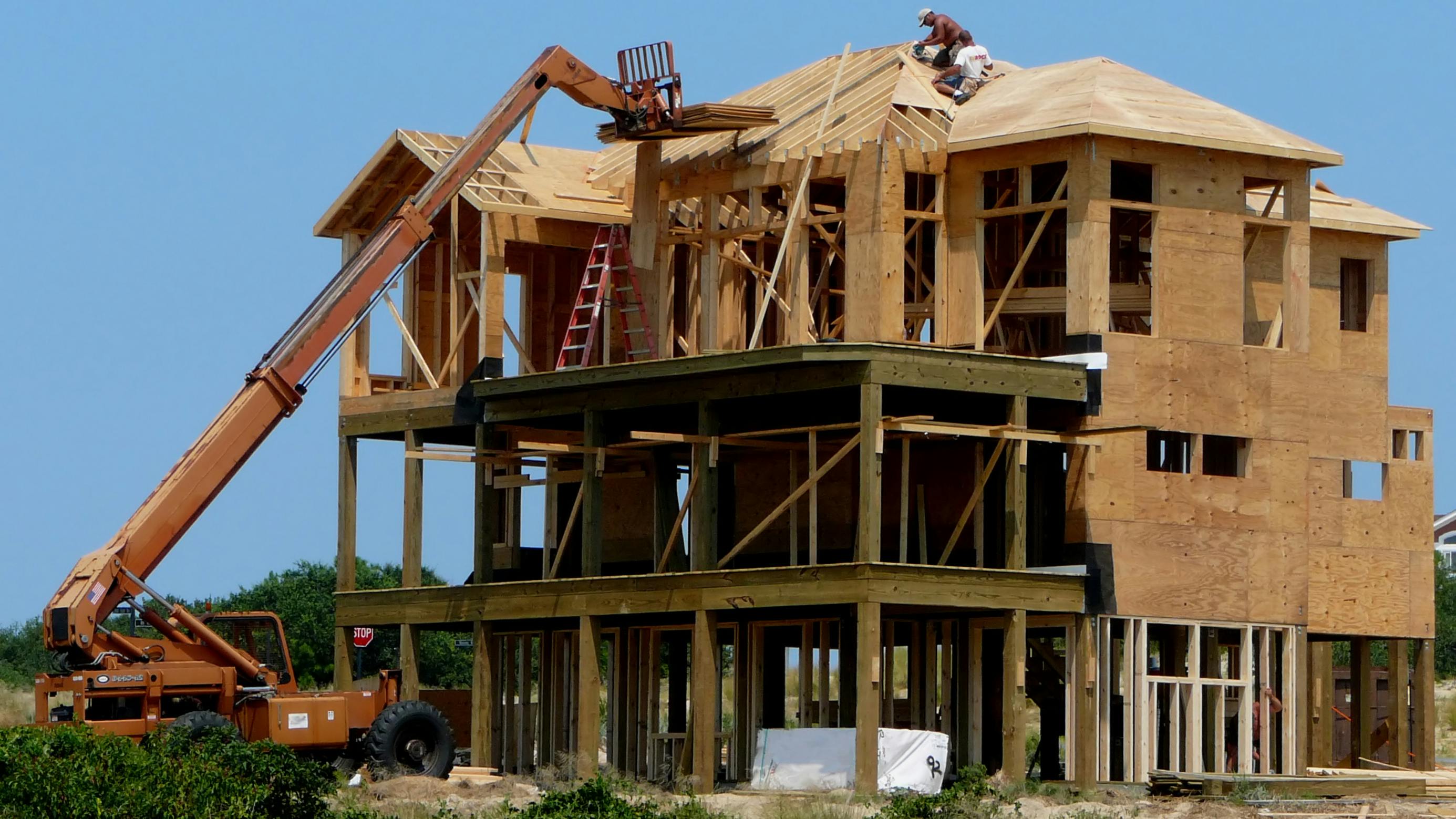 Construction workers building a beachfront home at the Outer Banks of North Carolina