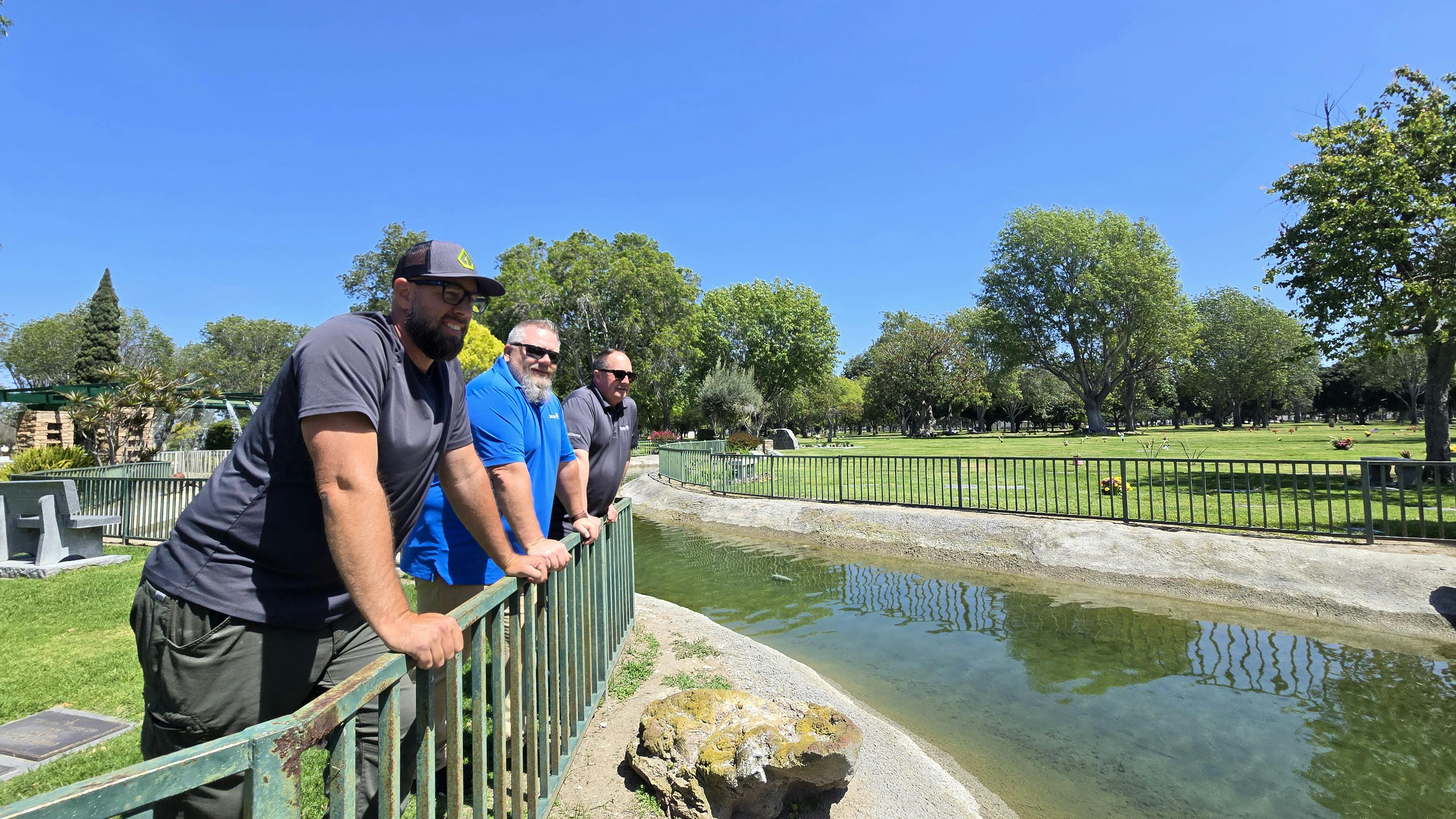 Dan Mudd (Mudd Landscapes), Andrew Chase (Davey Institute Project Manager), and Brian Borkowicz (Davey Institute Biochar Expert) at Westminster Memorial Park&rsquo;s restored irrigation pond.