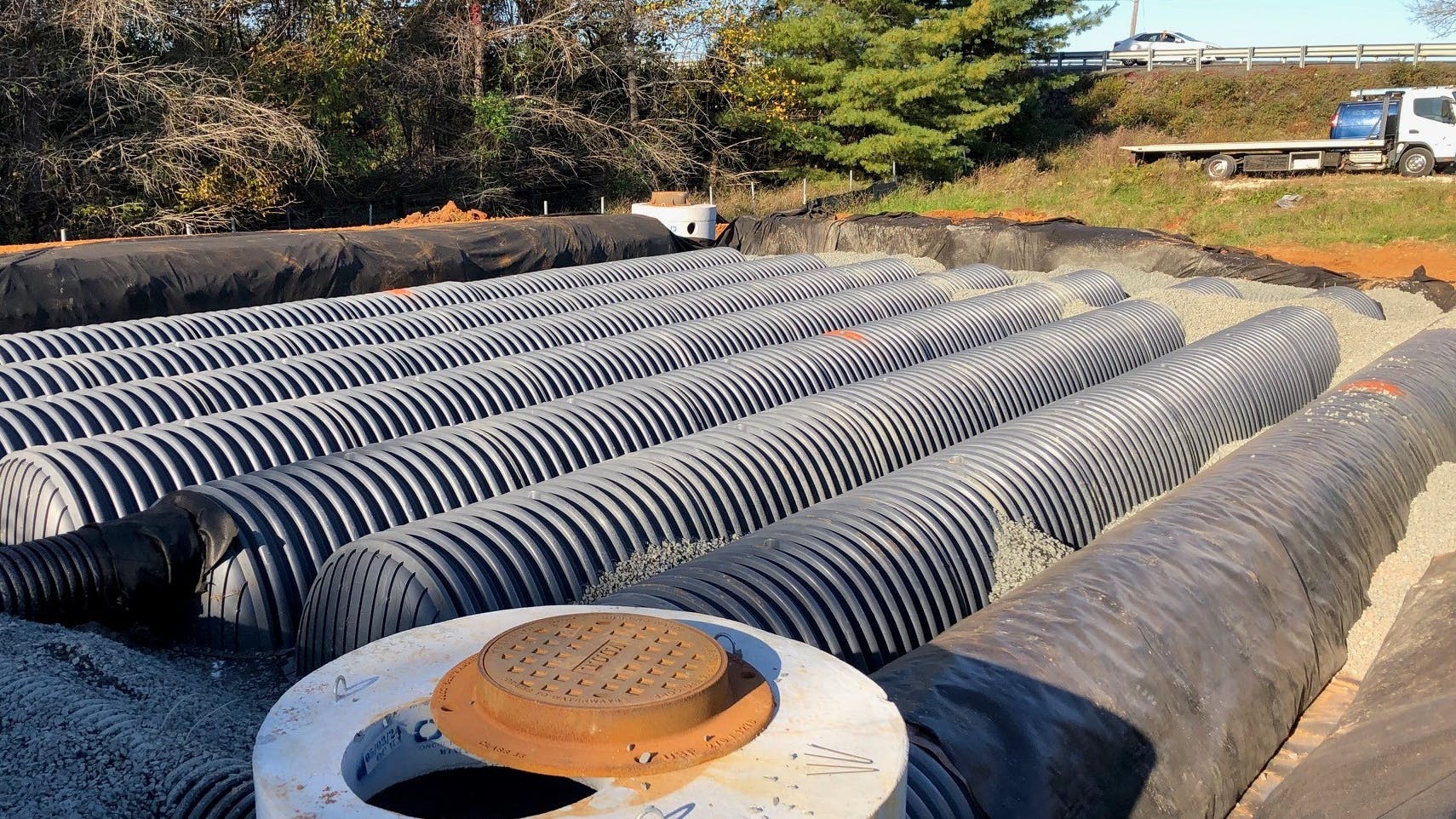 The underground stormwater collection chambers replaced an open basin to give Warrenton Equipment more parking area for its heavy equipment.