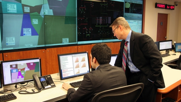 PNNL39s Power Grid Integrator has demonstrated up to a 50 percent improvement in forecasting future electricity needs over several commonly used tools Project lead Luke Gosink right consults on the use of the new tool which could save millions in wasted electricity costs