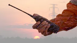 Lineman with twoway radio Lineman with twoway radio