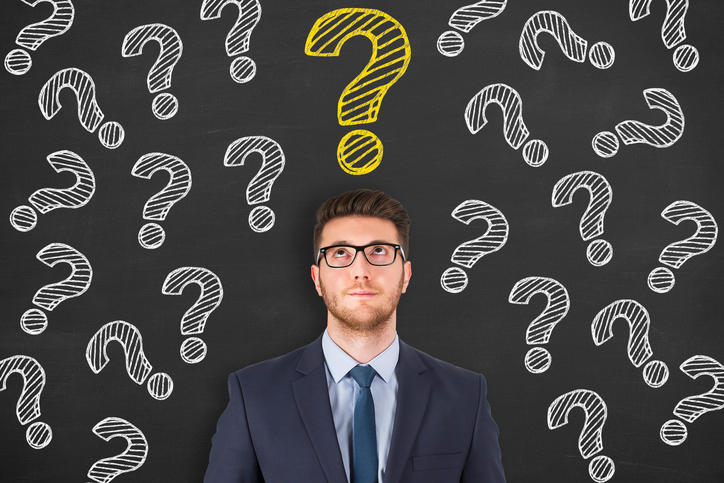 man with question marks