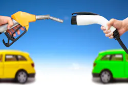 electric car and gasoline car concept. hand holding gas pump and power connector for refuel electric car and gasoline car concept. hand holding gas pump and power connector for refuel