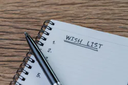 An open notebook with a pen on top An open notebook with a pen on top