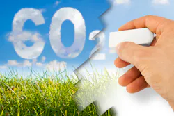 A composite image showing a hand erasing carbon dioxide written in the sky A composite image showing a hand erasing carbon dioxide written in the sky