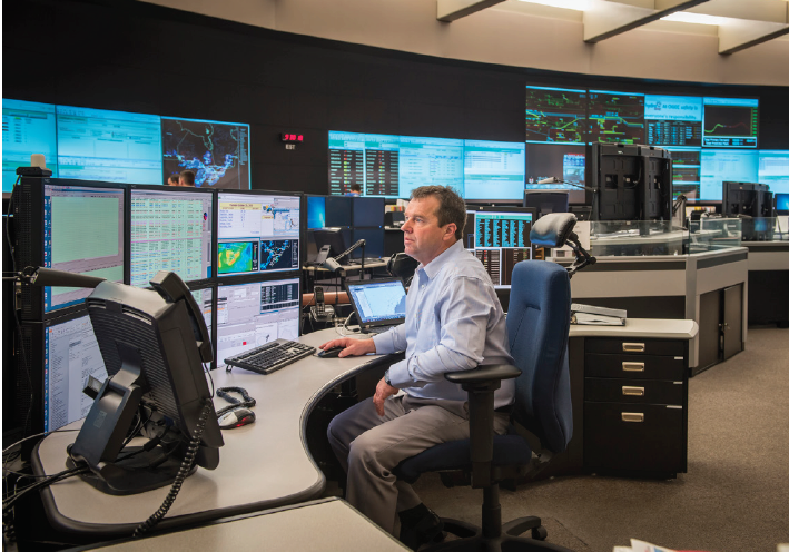 A man working in a grid control center