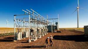 Workers By Substation Wind Turbine