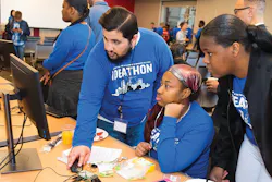 Mentor leads ComEd STEM program students in project research. Mentor leads ComEd STEM program students in project research.